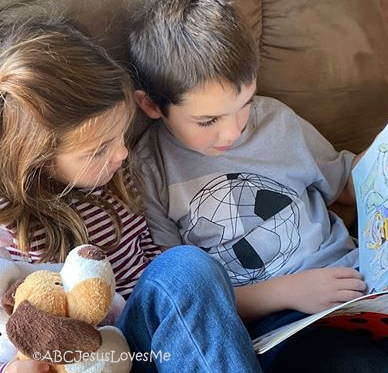 Two children reading books.