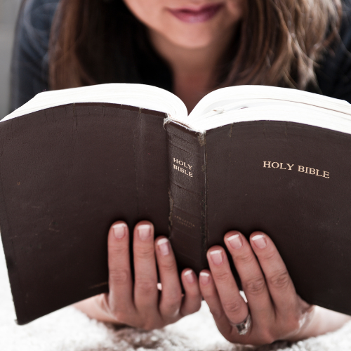 Woman reading her Bible.