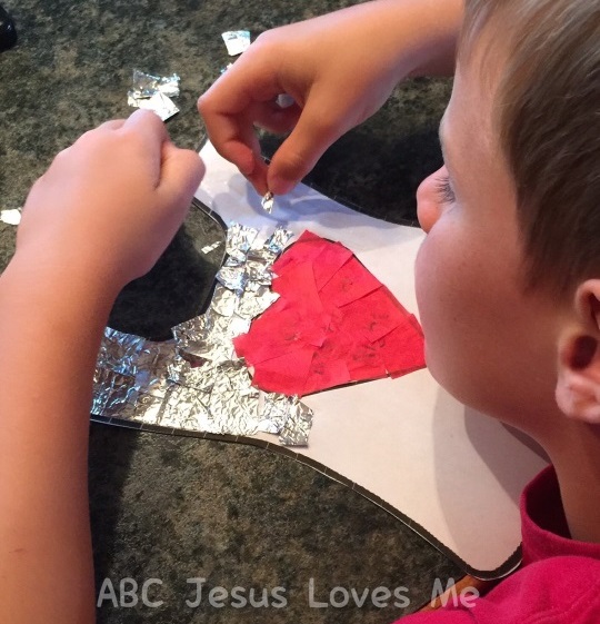 Child creating a shield of faith.