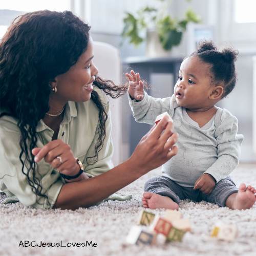 Parent and baby with blocks