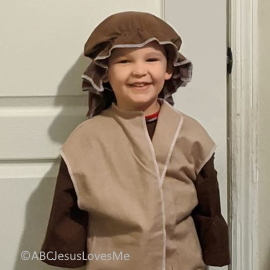 Little boy dressed up like Bible character.