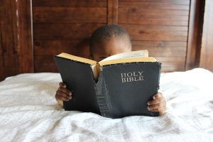 Boy holding a Bible