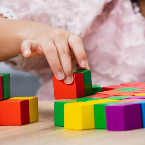 Child playing with wooden Blocks