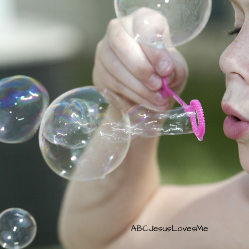 Child blowing bubbles