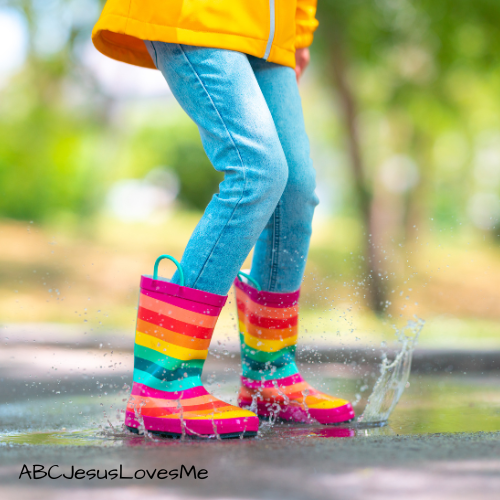 Child jumping in a spring puddle