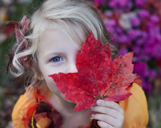 A girl holding a leaf