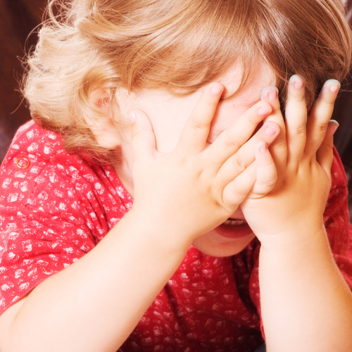 Child playing hide-and-week.