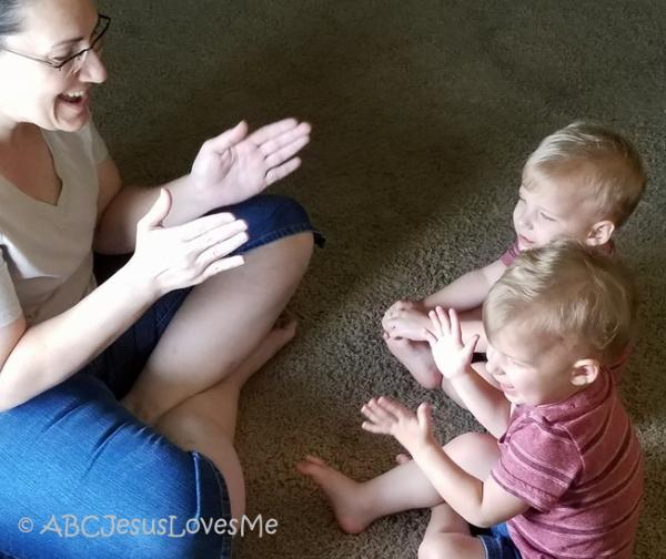 Mom and twins singing and clapping