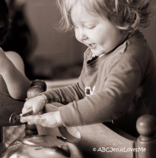 Child playing musical instruments.