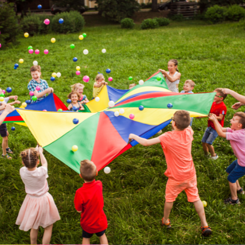 Children with a parachute