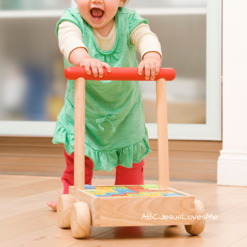 Child pushing a push toy