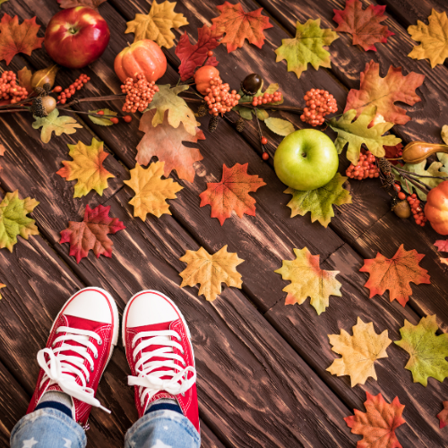 Thanksgiving background with a child's shoes.