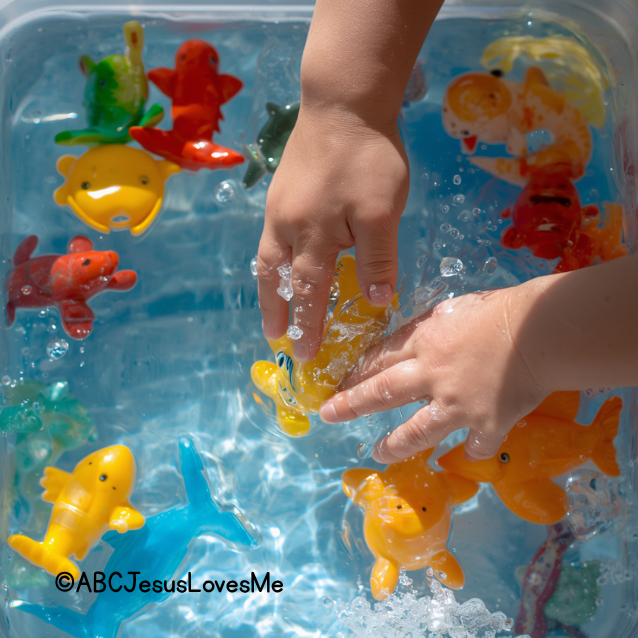 Child playing in water sensory bin