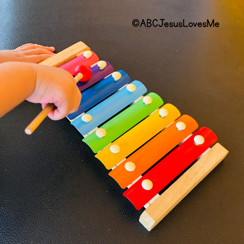 Child playing a xylophone